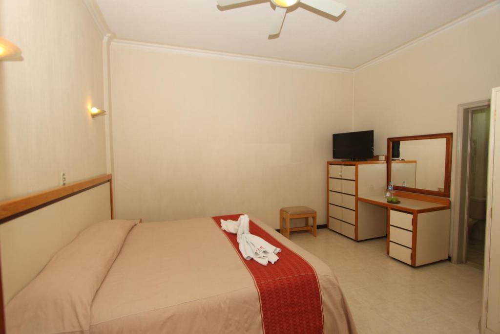 Postel nebo postele na pokoji v ubytování Hotel Ferri