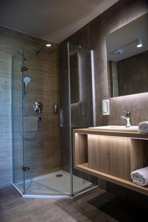 Koupelna v ubytování Lignum Hotel