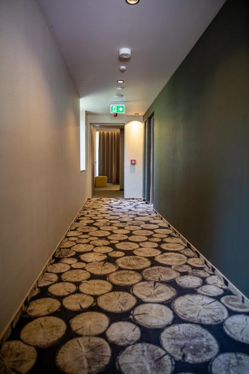 Postel nebo postele na pokoji v ubytování Lignum Hotel