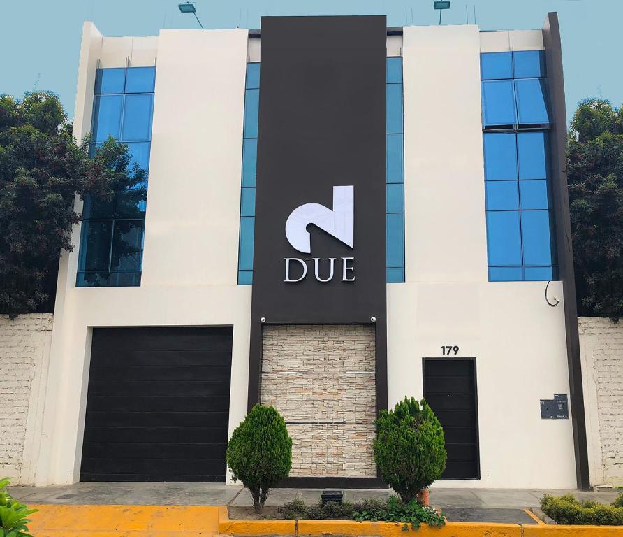 a building with the uber logo on it at Due in Trujillo
