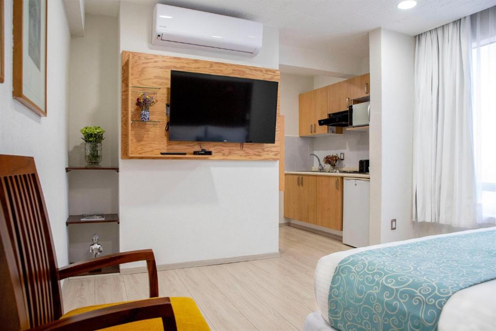 Kuchyň nebo kuchyňský kout v ubytování Suites Coben Apartamentos Amueblados