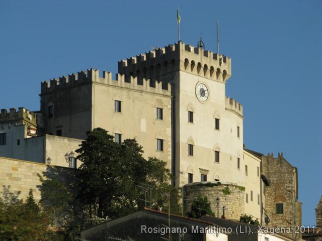 a building with a clock tower on top of it at Piccolo Hotel in Rosignano Solvay