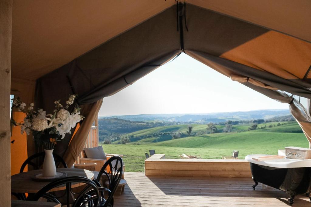 a large tent with a view of a green field at Rosewood Farmstay in Binda