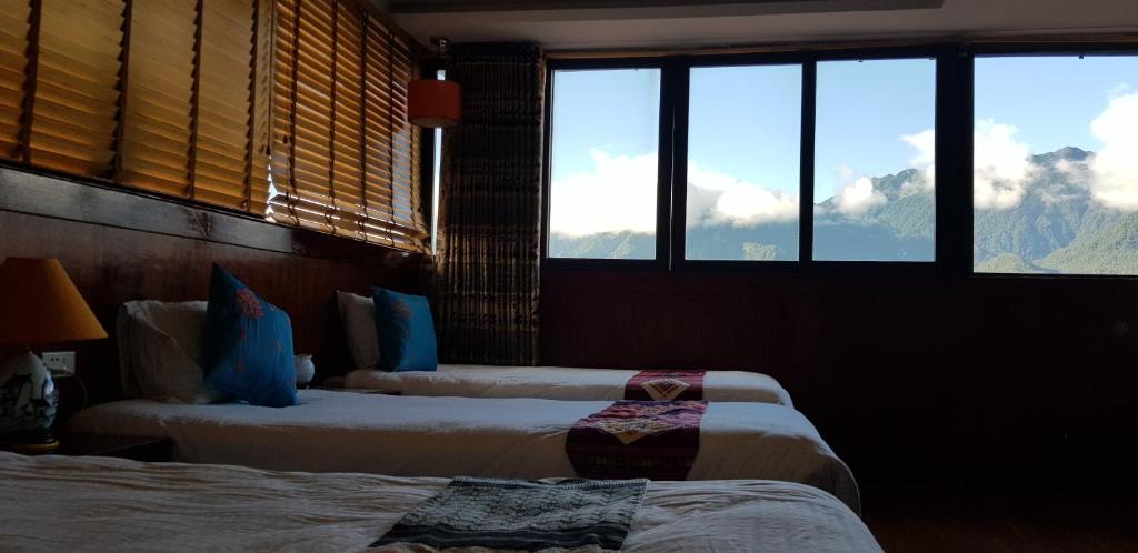 Postel nebo postele na pokoji v ubytování Anise Sapa Hotel