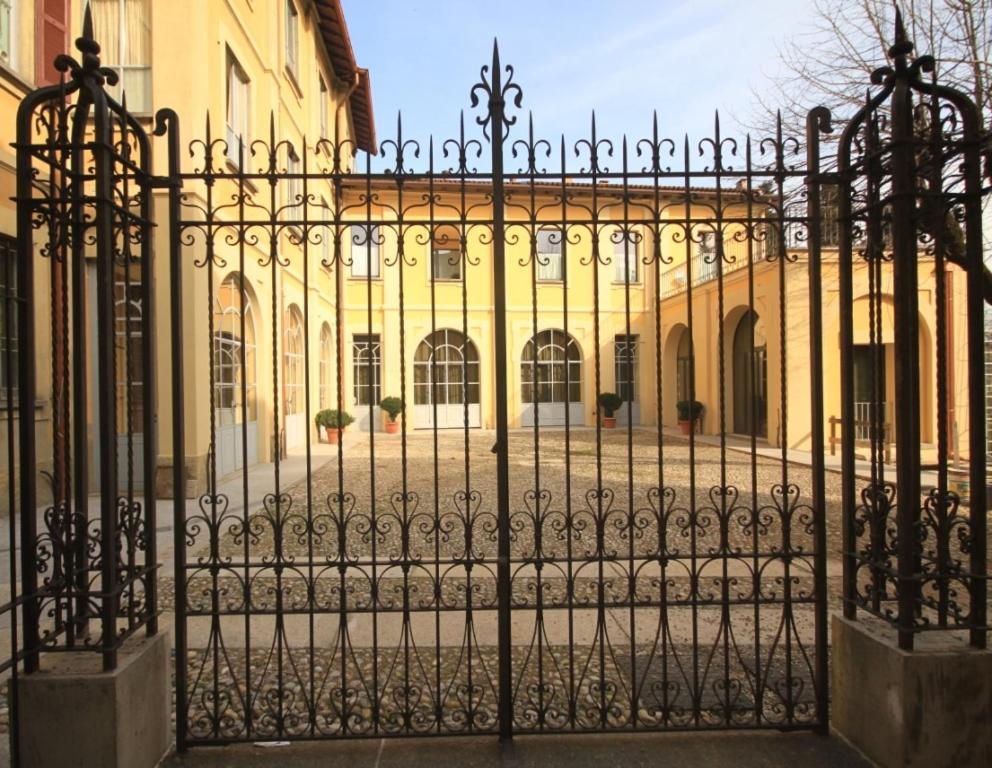 an iron gate in front of a building at Lisander B&B in Seregno