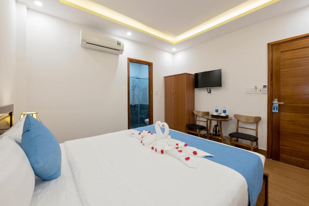 Postel nebo postele na pokoji v ubytování Hoi An Impression Homestay
