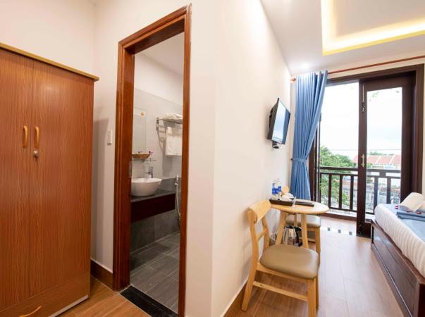 Postel nebo postele na pokoji v ubytování Hoi An Impression Homestay