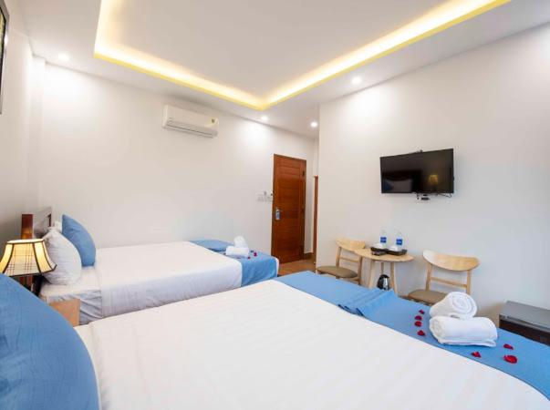 Postel nebo postele na pokoji v ubytování Hoi An Impression Homestay