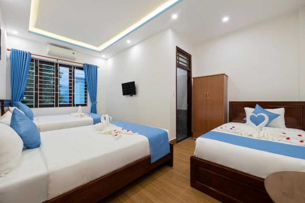 Postel nebo postele na pokoji v ubytování Hoi An Impression Homestay