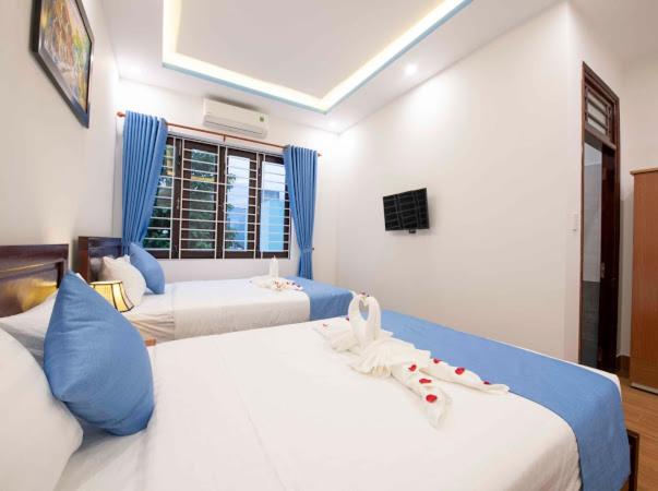 Postel nebo postele na pokoji v ubytování Hoi An Impression Homestay