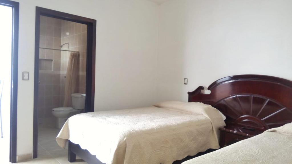 Postel nebo postele na pokoji v ubytování Casa de Cactus