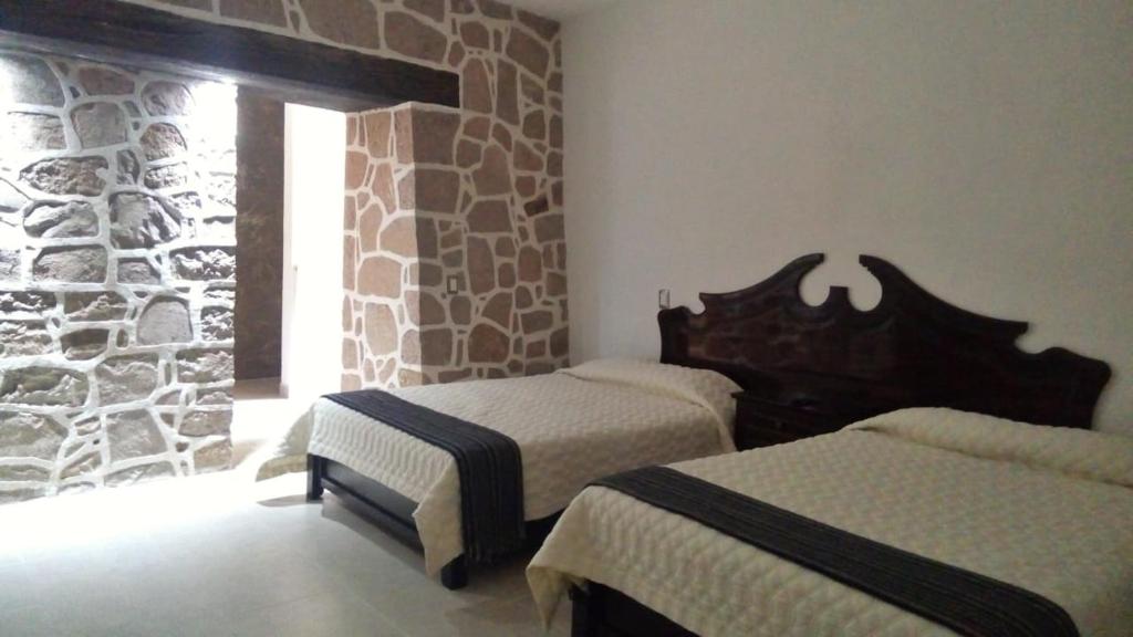 Postel nebo postele na pokoji v ubytování Casa de Cactus