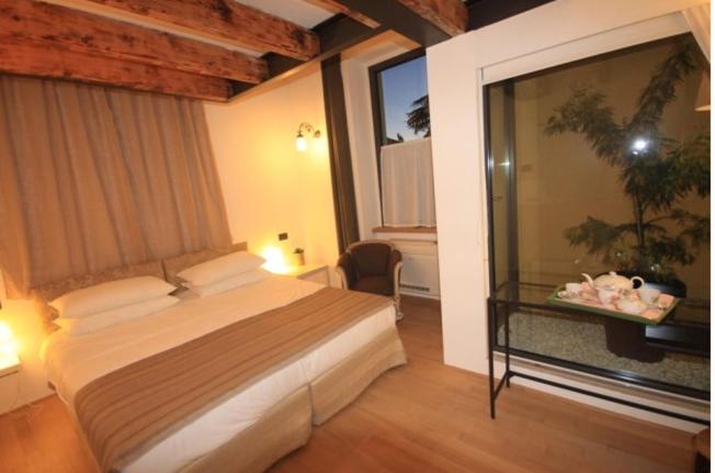 Postel nebo postele na pokoji v ubytování Lisander B&B suite and terrace