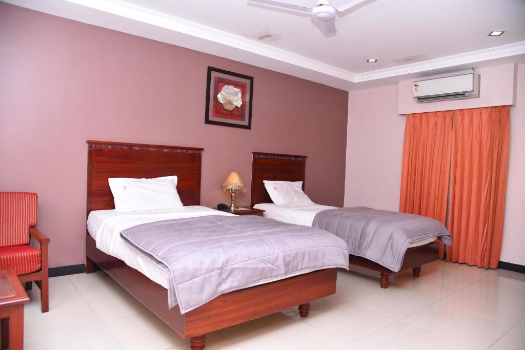 Postel nebo postele na pokoji v ubytování Hotel Subhalakshmi Palace