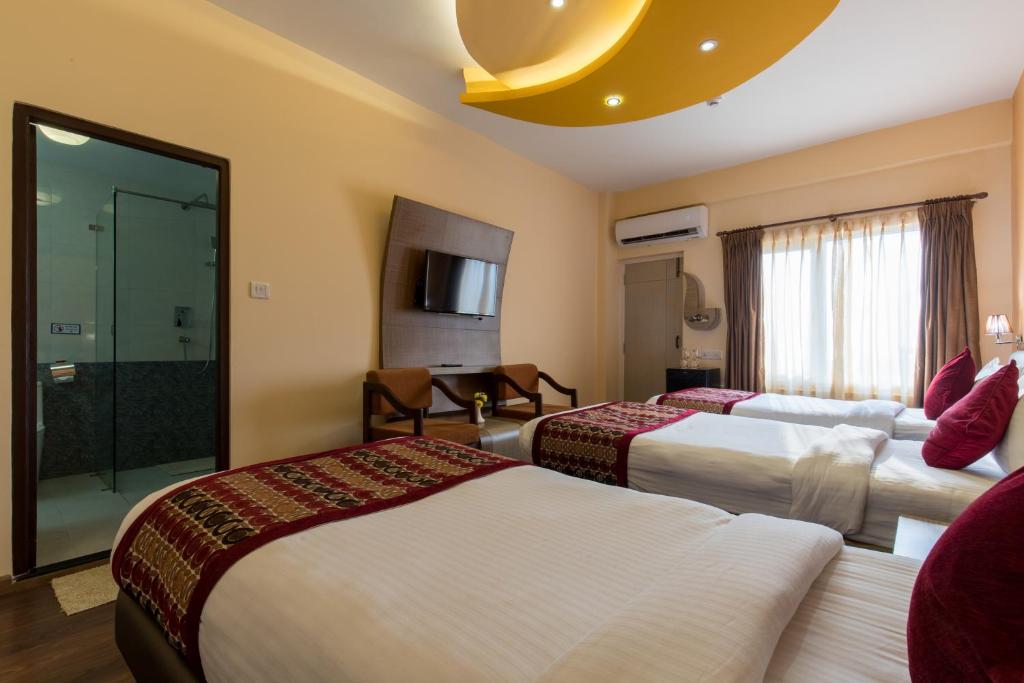 Postel nebo postele na pokoji v ubytování Hotel Moonlight