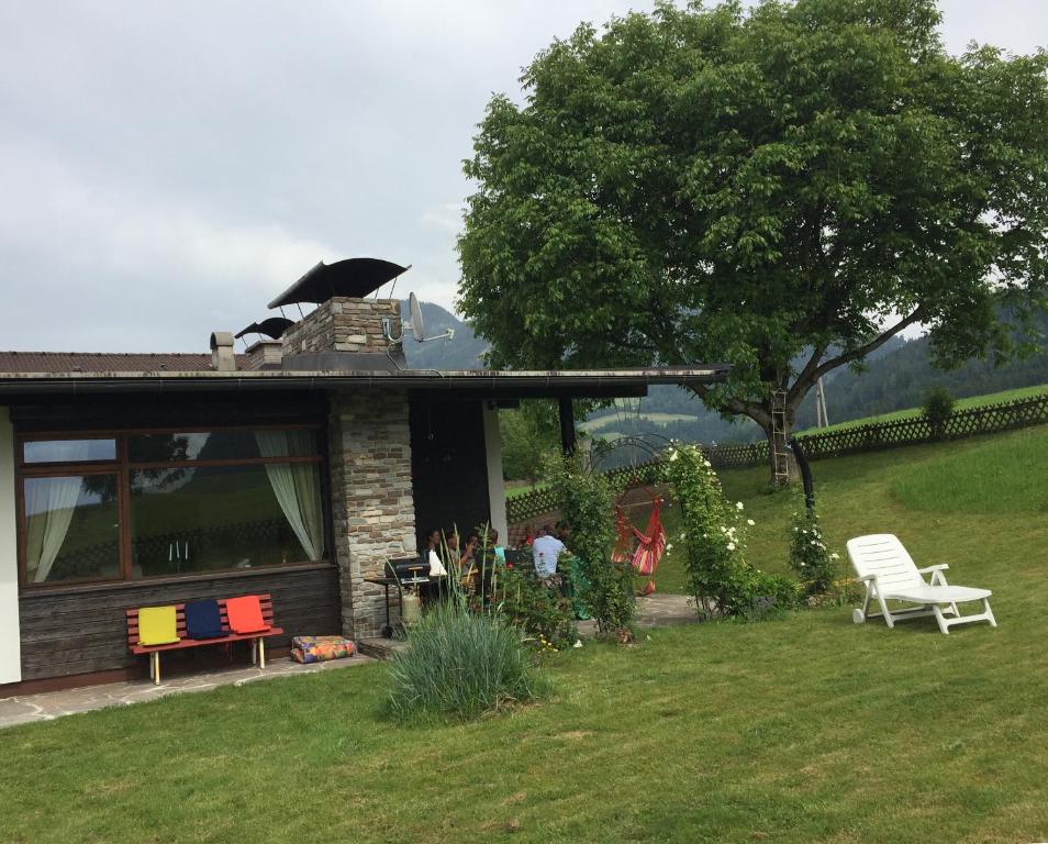 a house with an umbrella on top of it at Wohlfühlchalet Tirol in Reith im Alpbachtal
