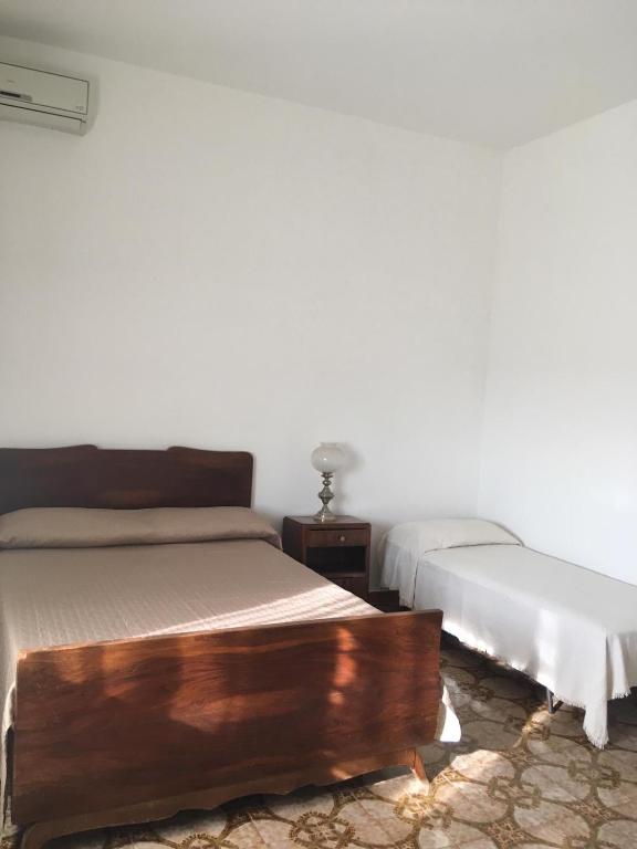 A bed or beds in a room at Casa Vacanze nel Verde a 5 Km dal mare