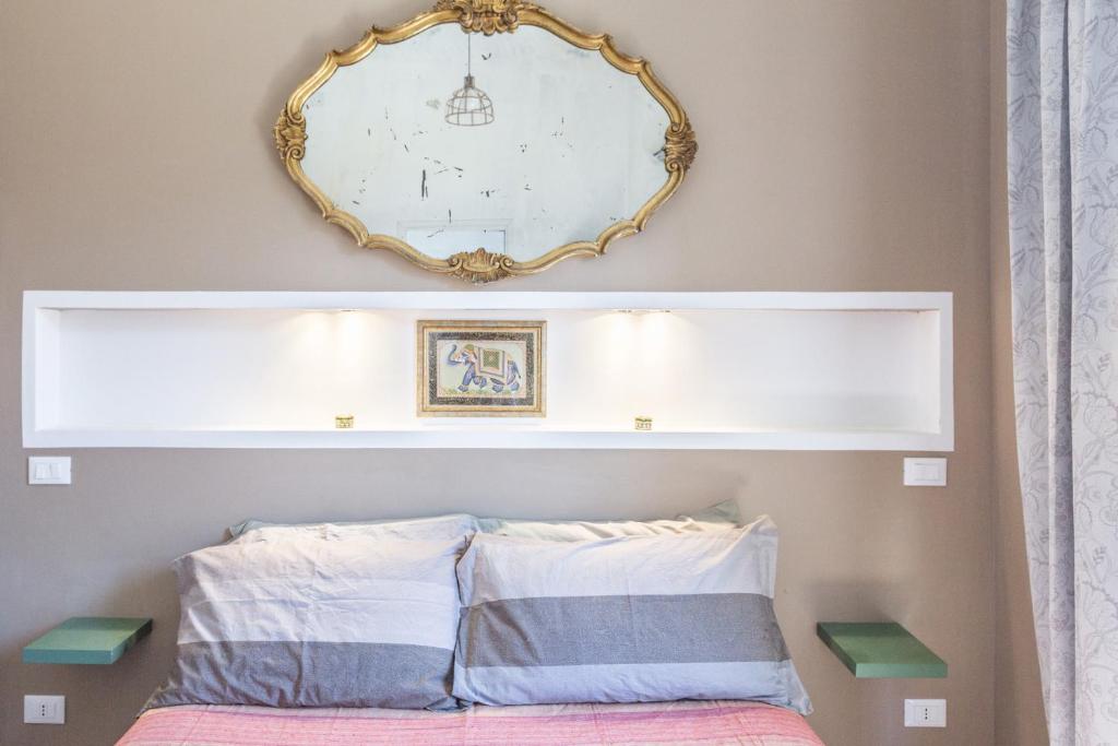A bed or beds in a room at Gò Gò House 2 Casa Aprile