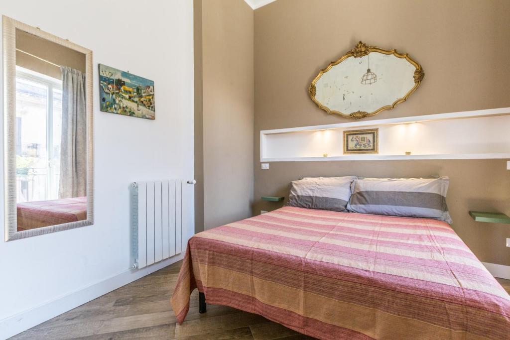 A bed or beds in a room at Gò Gò House 2 Casa Aprile