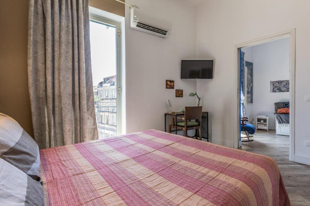 A bed or beds in a room at Gò Gò House 2 Casa Aprile