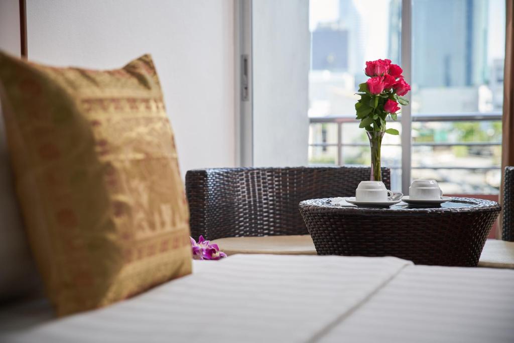 Postel nebo postele na pokoji v ubytování KC Place Hotel Pratunam