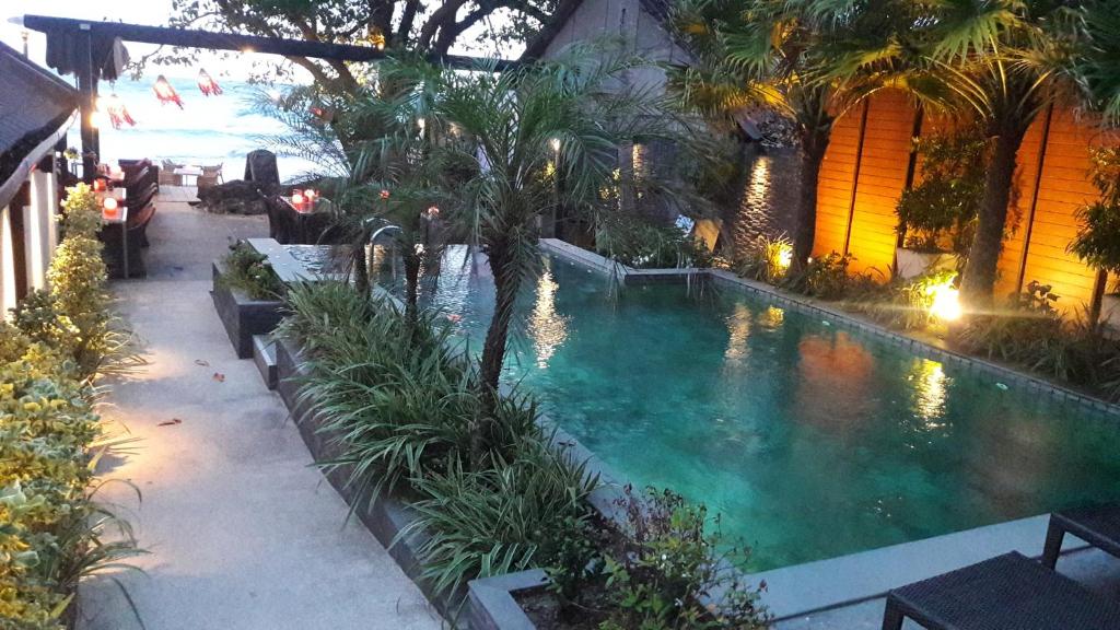a swimming pool in the middle of a building at 15 Palms Beach Resort in Ko Chang
