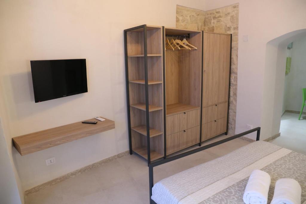 TV a/nebo společenská místnost v ubytování Locus Pendinelli Trani