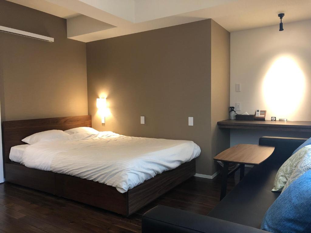 Postel nebo postele na pokoji v ubytování Condominium MIRAHAKONE