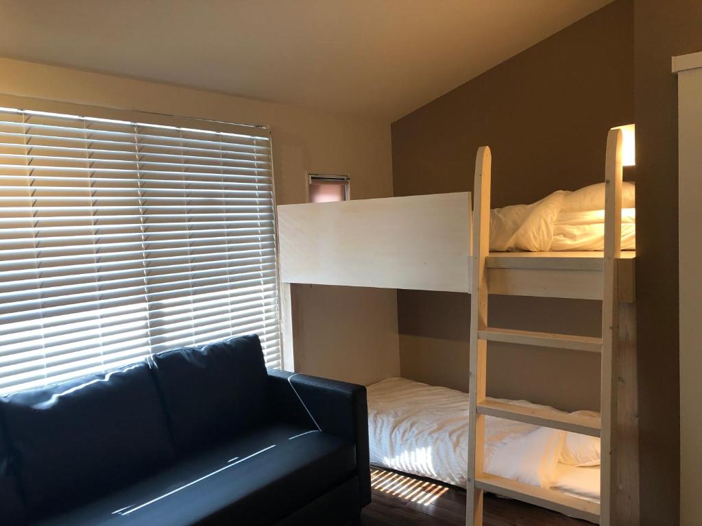 Postel nebo postele na pokoji v ubytování Condominium MIRAHAKONE