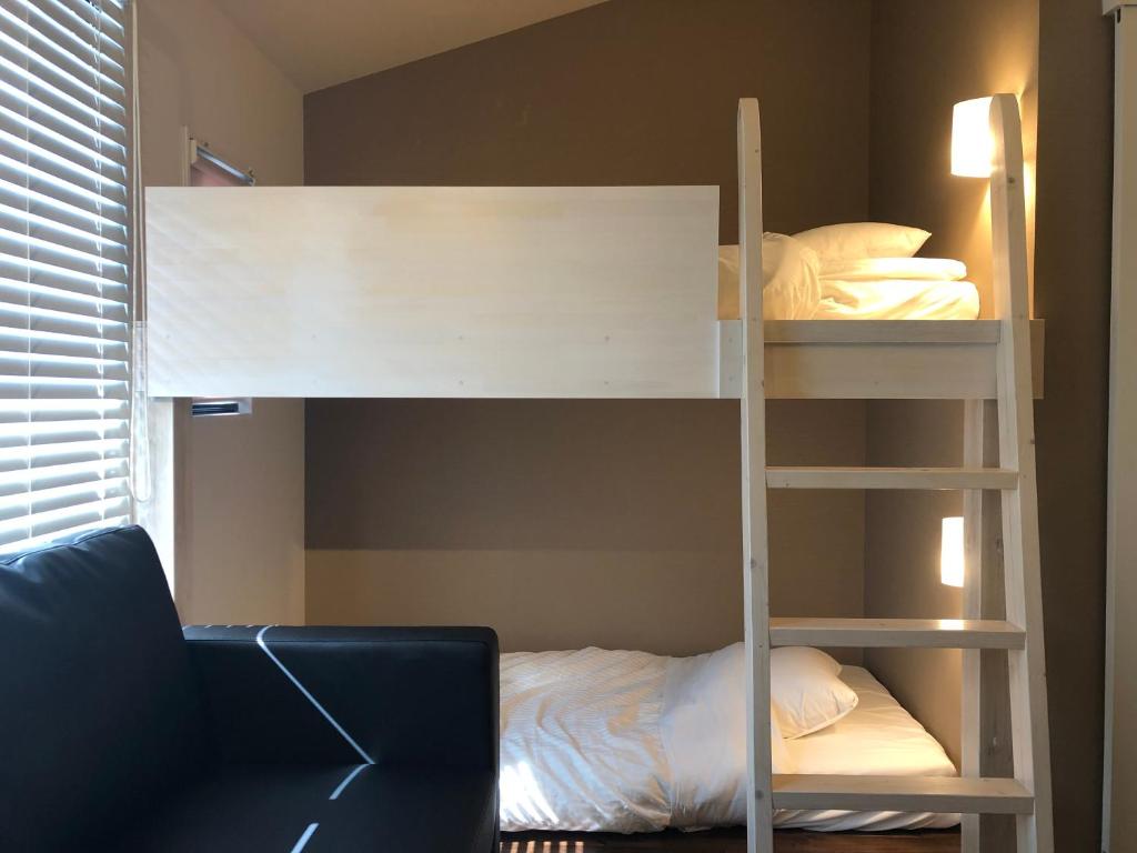 Postel nebo postele na pokoji v ubytování Condominium MIRAHAKONE