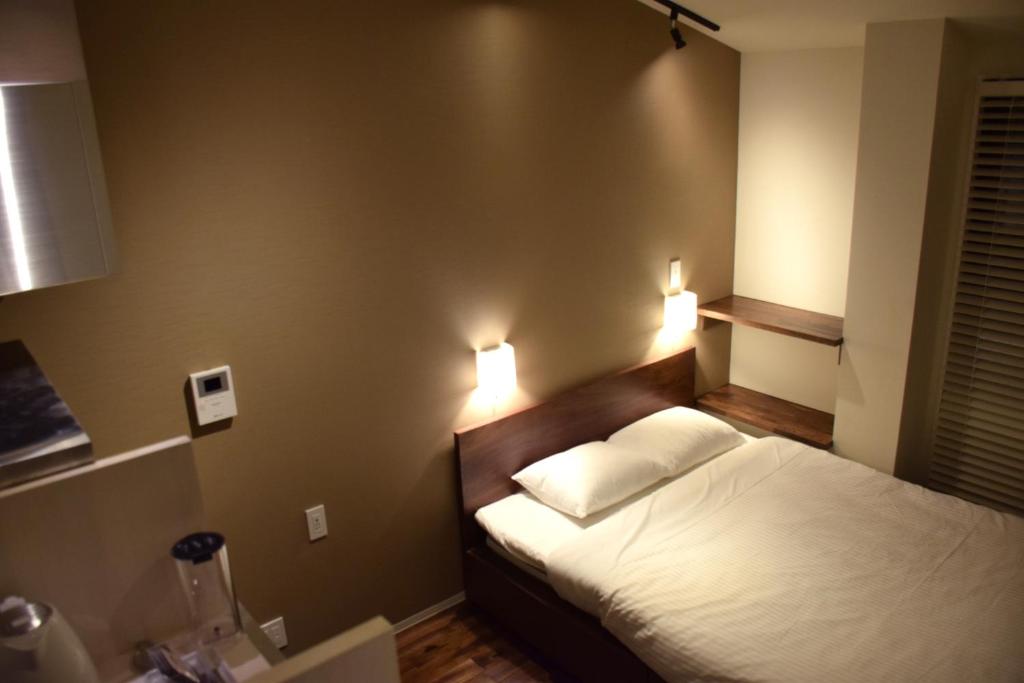 Postel nebo postele na pokoji v ubytování Condominium MIRAHAKONE