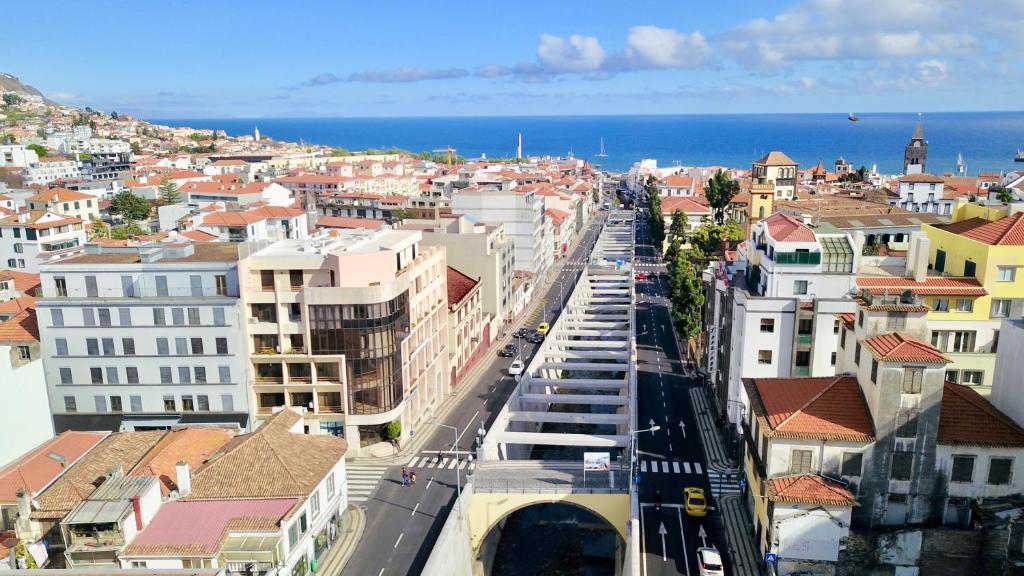 an aerial view of a city with buildings and the ocean at Our Dream Downtown Experience by AnaLodges in Funchal