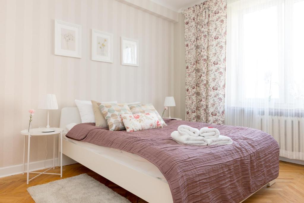 Posteľ alebo postele v izbe v ubytovaní Chmielna Central Warsaw Apartment