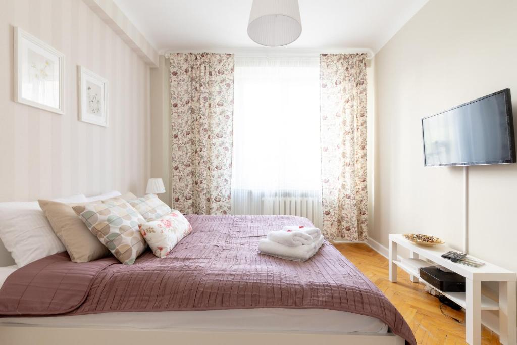 Posteľ alebo postele v izbe v ubytovaní Chmielna Central Warsaw Apartment