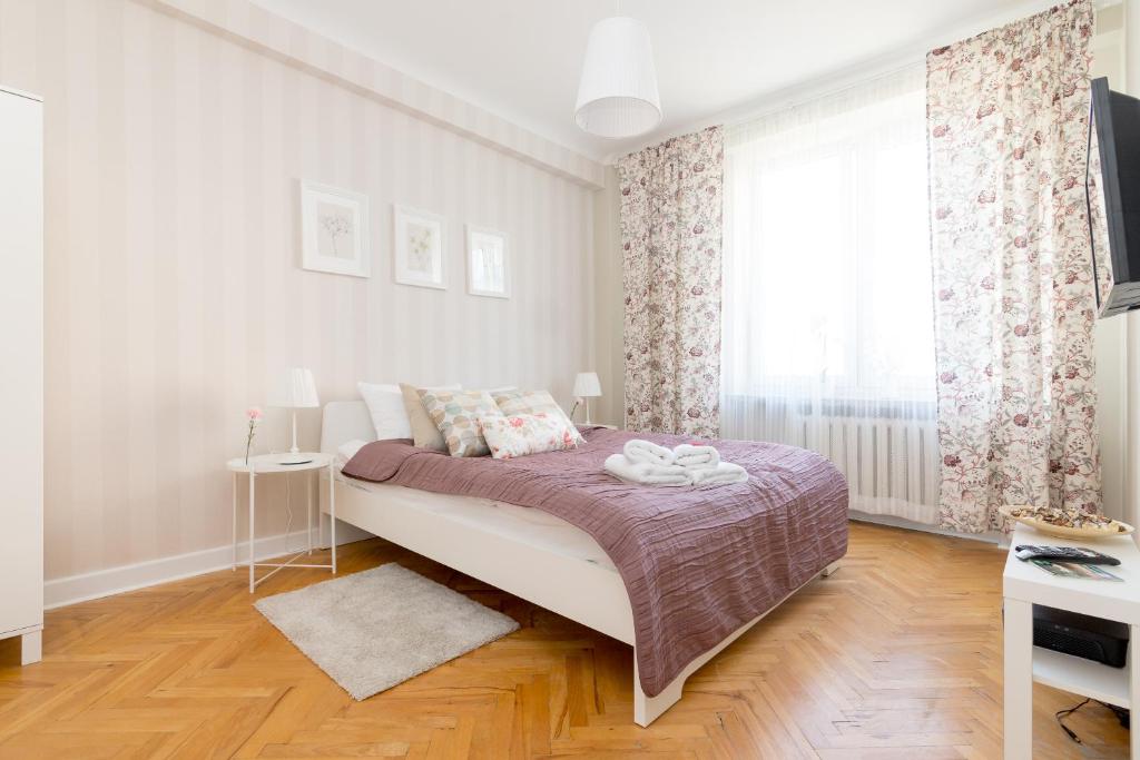 Posteľ alebo postele v izbe v ubytovaní Chmielna Central Warsaw Apartment