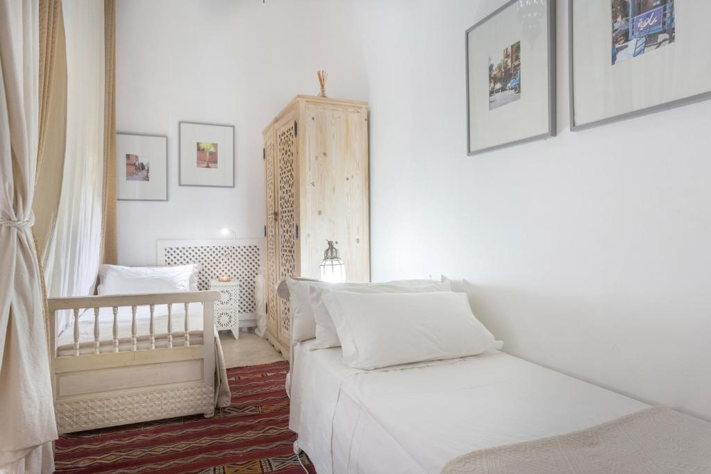 Postel nebo postele na pokoji v ubytování Riad Azoulay