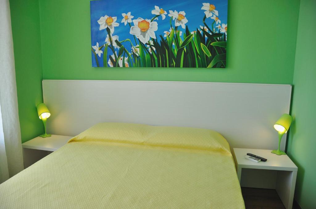Postel nebo postele na pokoji v ubytování I Tre Fiori