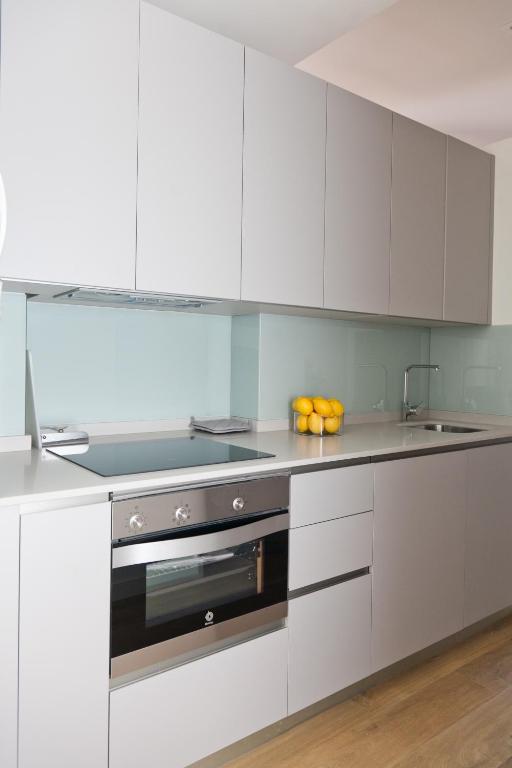 Kuchyň nebo kuchyňský kout v ubytování GoToSeville GERONA SUITES