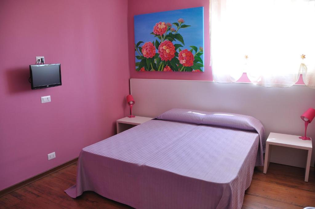Postel nebo postele na pokoji v ubytování I Tre Fiori