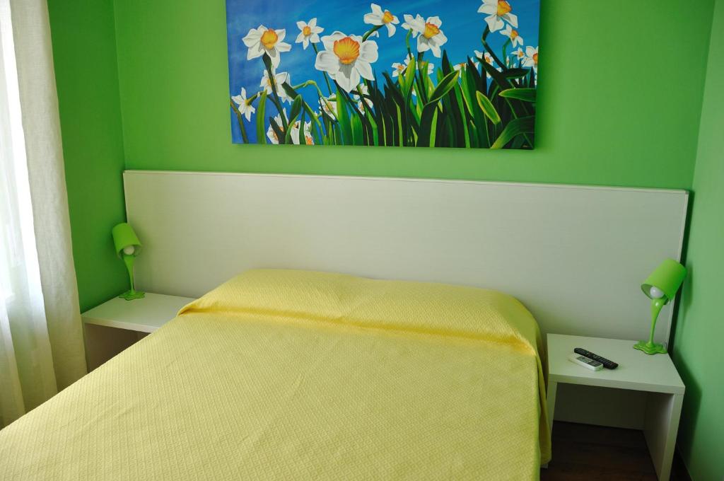 Postel nebo postele na pokoji v ubytování I Tre Fiori