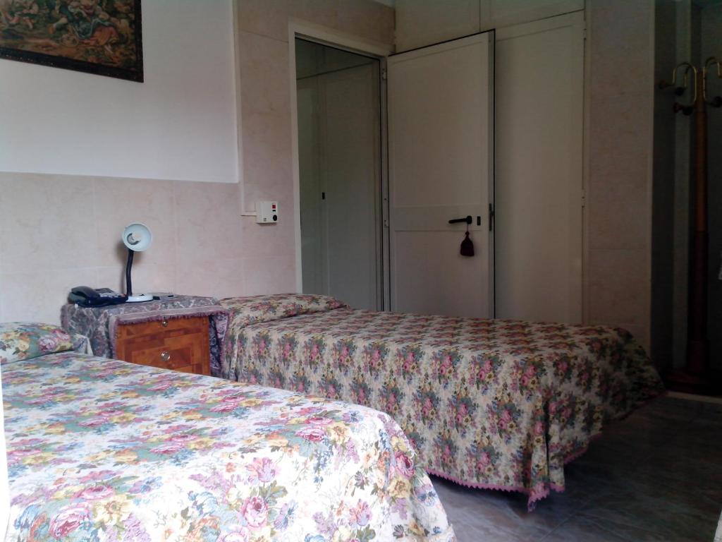 Postel nebo postele na pokoji v ubytování Hotel Stadler 2