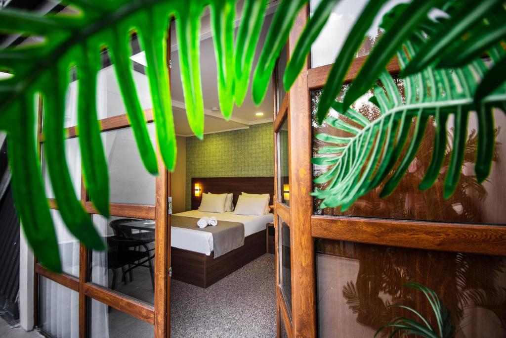 Postel nebo postele na pokoji v ubytování Margi Boutique Hotel by DNT Group