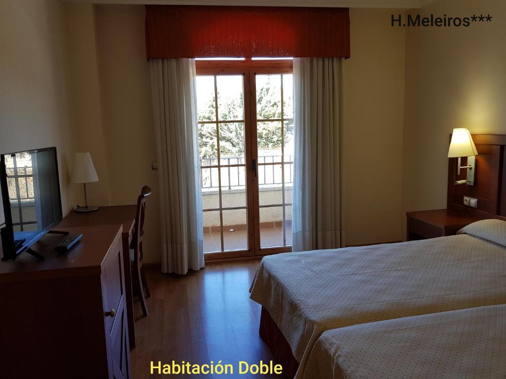 Postel nebo postele na pokoji v ubytování Hotel Meleiros