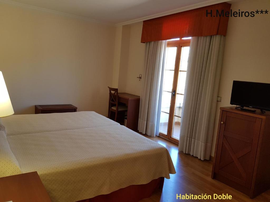 Postel nebo postele na pokoji v ubytování Hotel Meleiros