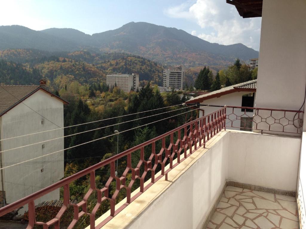 a balcony with a view of the mountains at Katya Guest House in Smolyan