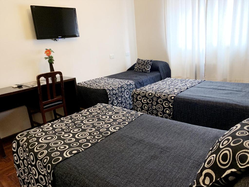 Postel nebo postele na pokoji v ubytování Hotel Premier