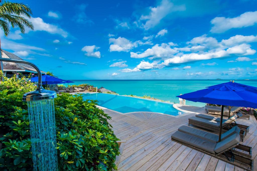 a resort with a swimming pool and the ocean at Cocobay Resort Antigua - All Inclusive - Adults Only in Johnsons Point