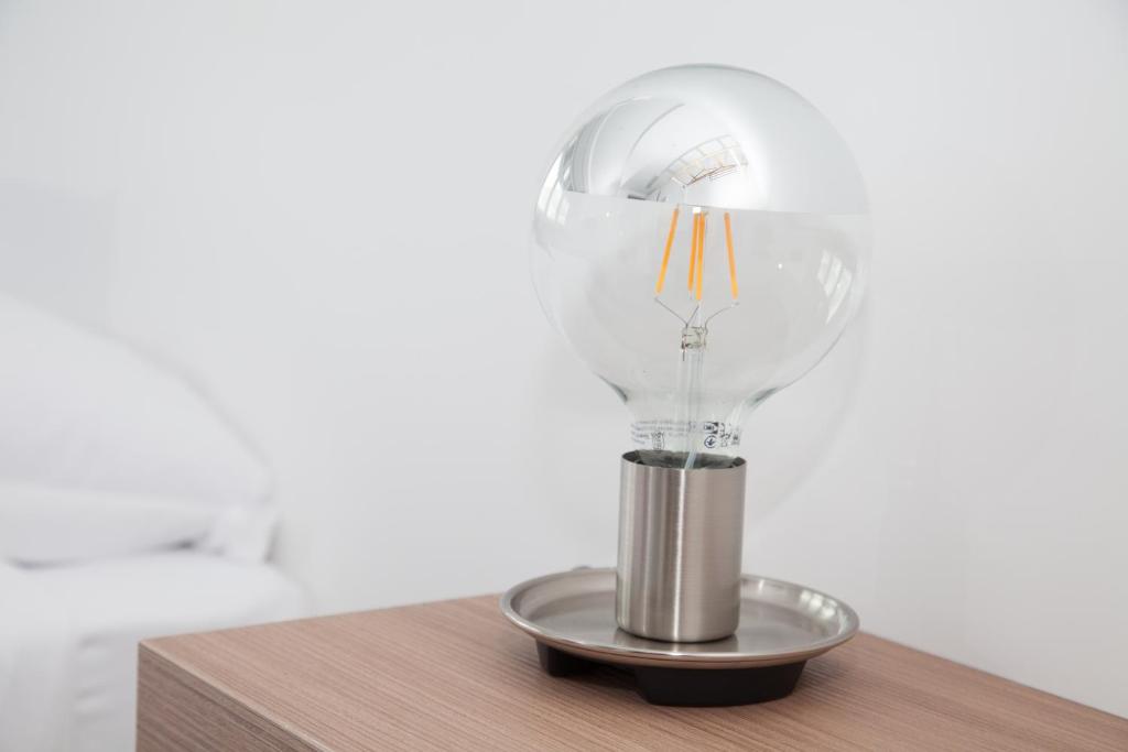 a light bulb sitting on top of a table at Cocor Suites & Design in Naples