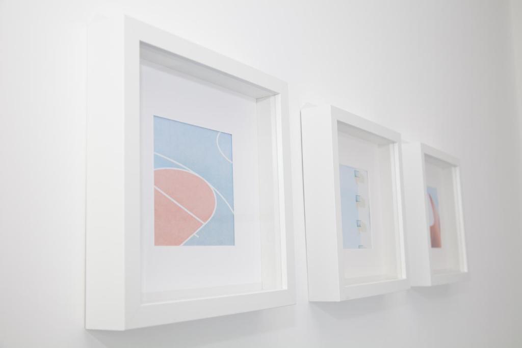 two white windows in a white room at Cocor Suites & Design in Naples