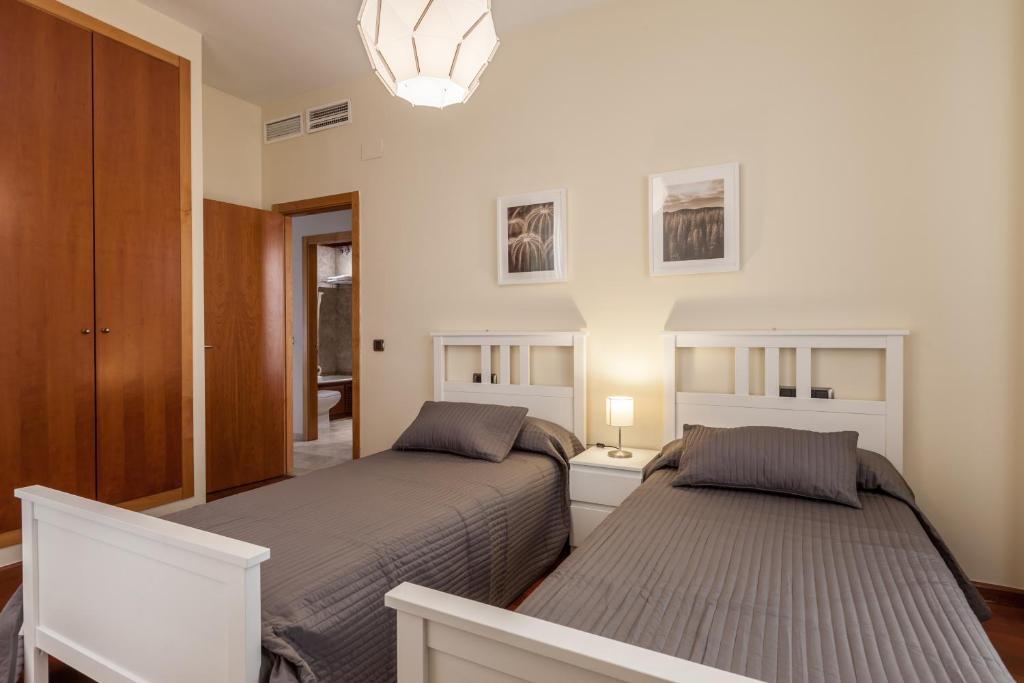 A bed or beds in a room at Atico de lujo en Aguilas